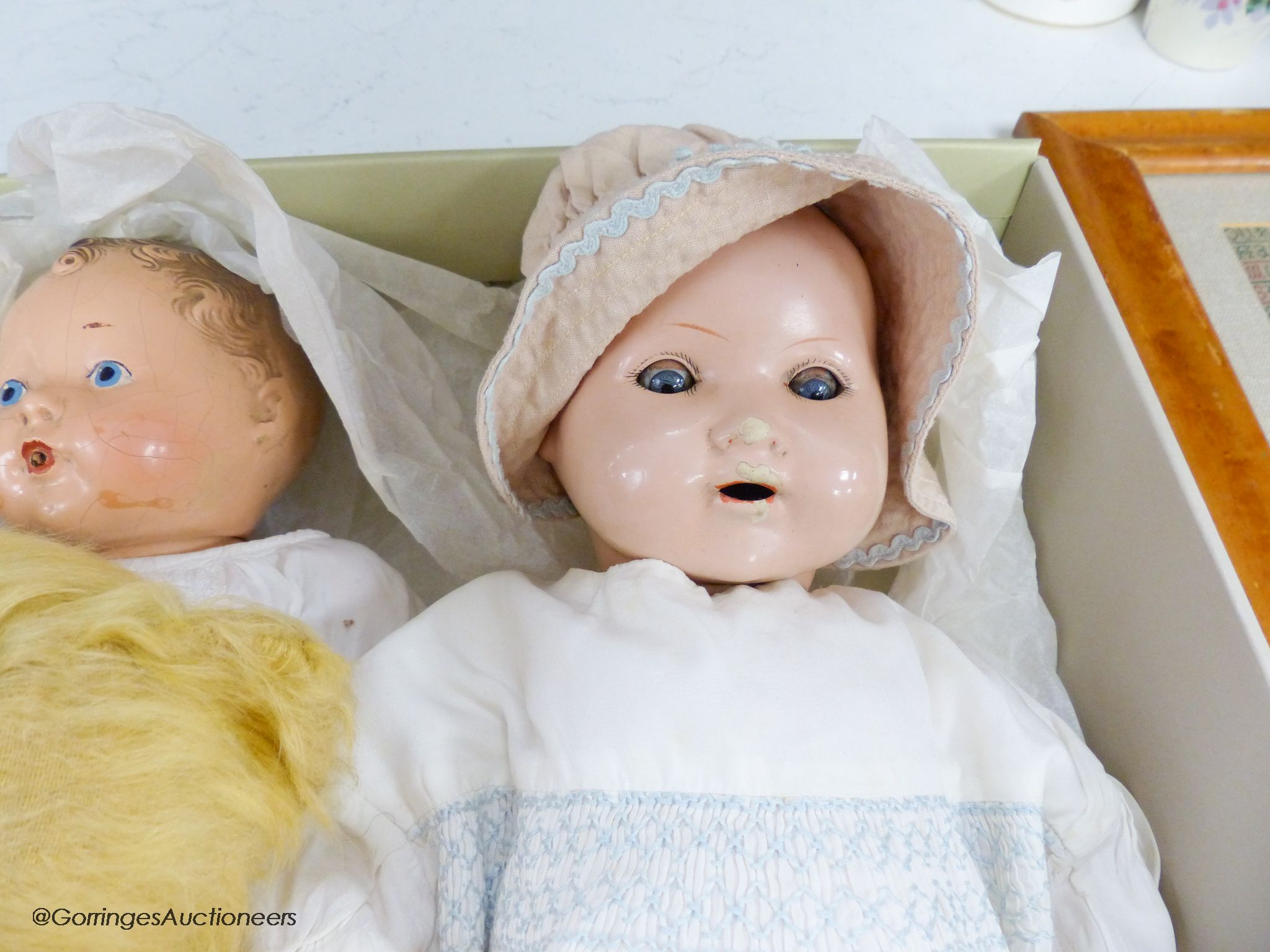 A 1939 Canadian reliable 'Netums' composition doll and a similar 'drunk-wet'doll, a gold mohair unjointed teddy bear and brown terrier
